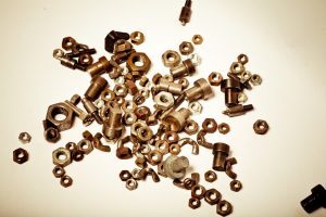 Dirty brass fasteners that can be recycled